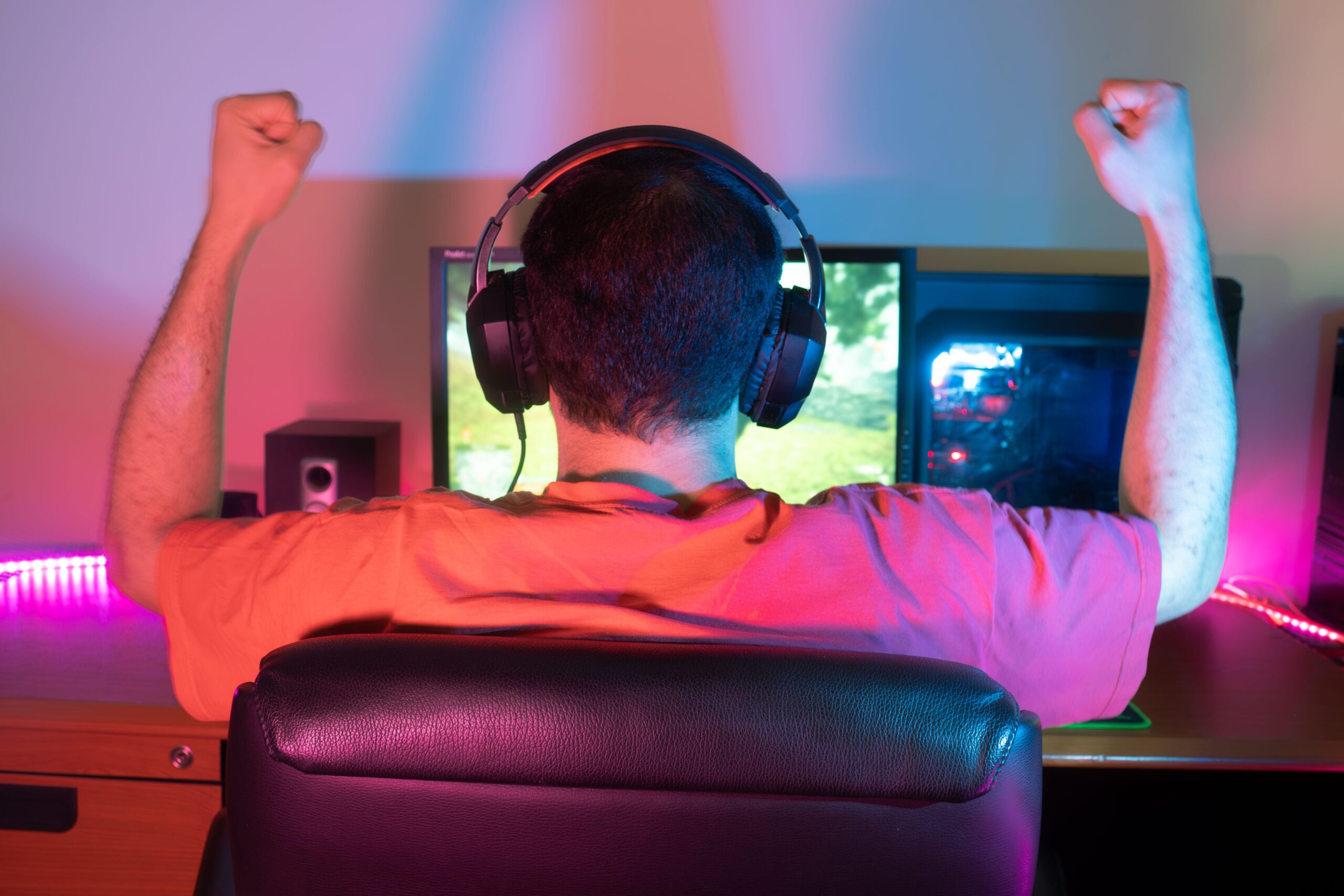 Contributor: noah Emad / Alamy Stock Photo A man celebrating while playing Schedule 1 on his PC